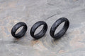 Three carbon fiber radius rings of various sizes with glossy finish.