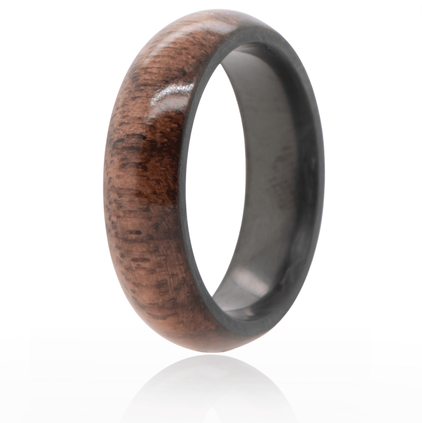 Walnut wood ring with forged carbon fiber interior. 