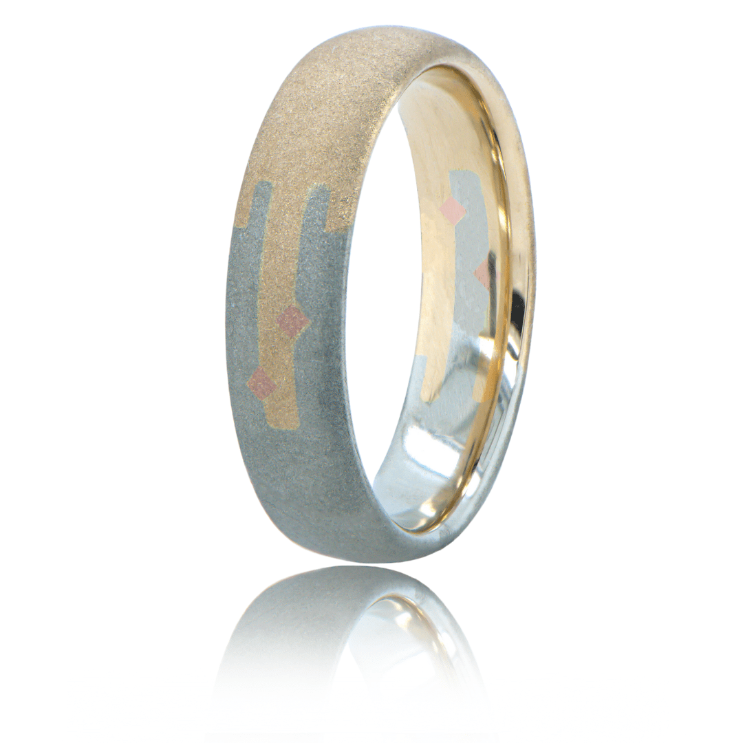 50% gold 50% silver ring connected by joints with a rough textured exterior.
