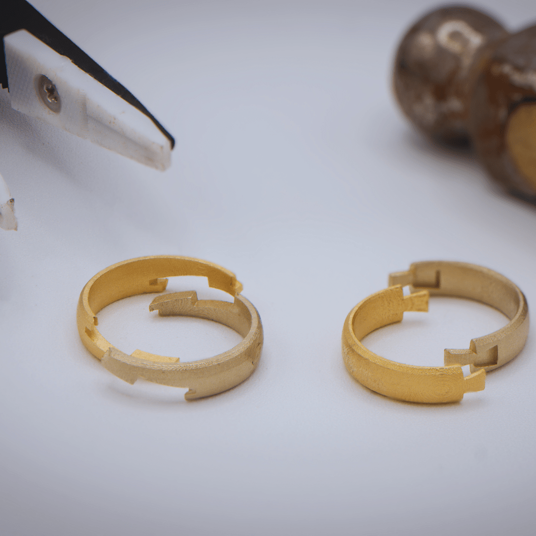 Disassembled Joinery Ring with a hammer and pliers in the background.