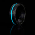 Carbon Fiber Ring with center inlayed turquoise glow stripe.