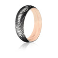 Wedding Band Damascus Steel ring with snakeskin patterned exterior and 18 Karat Rose Gold Interior. 