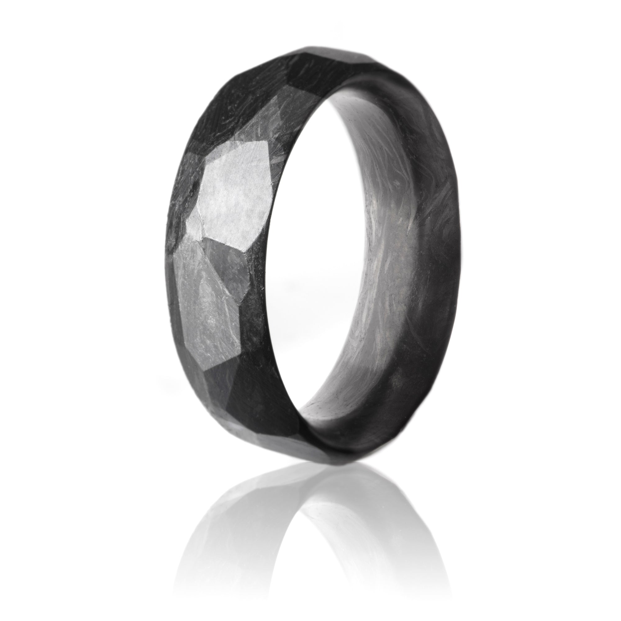 Forged Carbon ring with faceted exterior. 