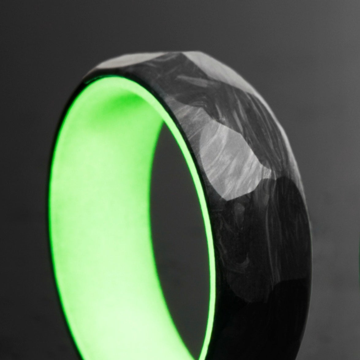 Green Glow Ring with Forged Carbon Fiber Faceted Exterior.