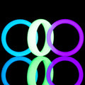 Blue, Green, and Purple Glow Rings made entirely of proprietary glow polymer.. 