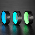 Blue, Turquoise, and Green glow rings with filament wound carbon fiber exterior. 
