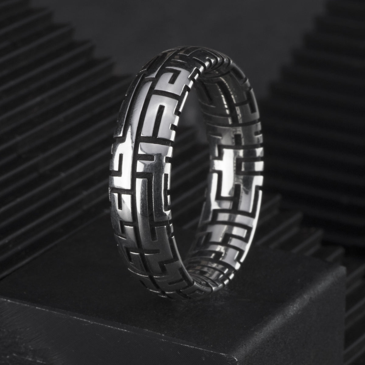 Sterling silver ring featuring a maze pattern.