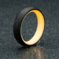 Carbon fiber radius ring with orange glow interior. 