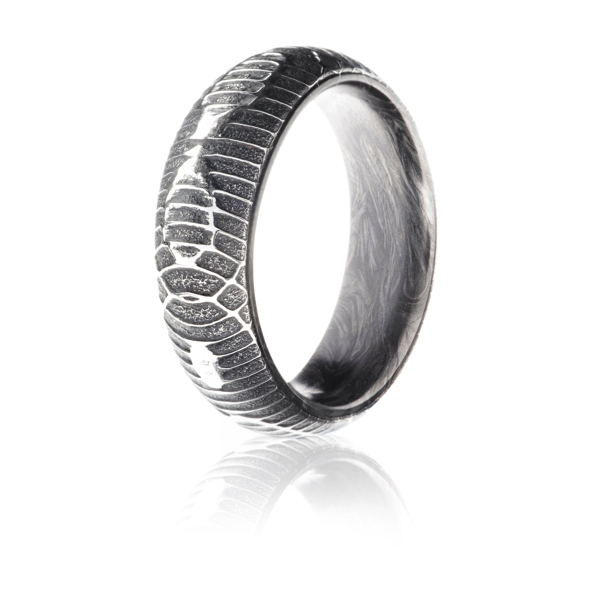 Damascus Steel ring with textured snakeskin pattern exterior and forged carbon fiber interior. 
