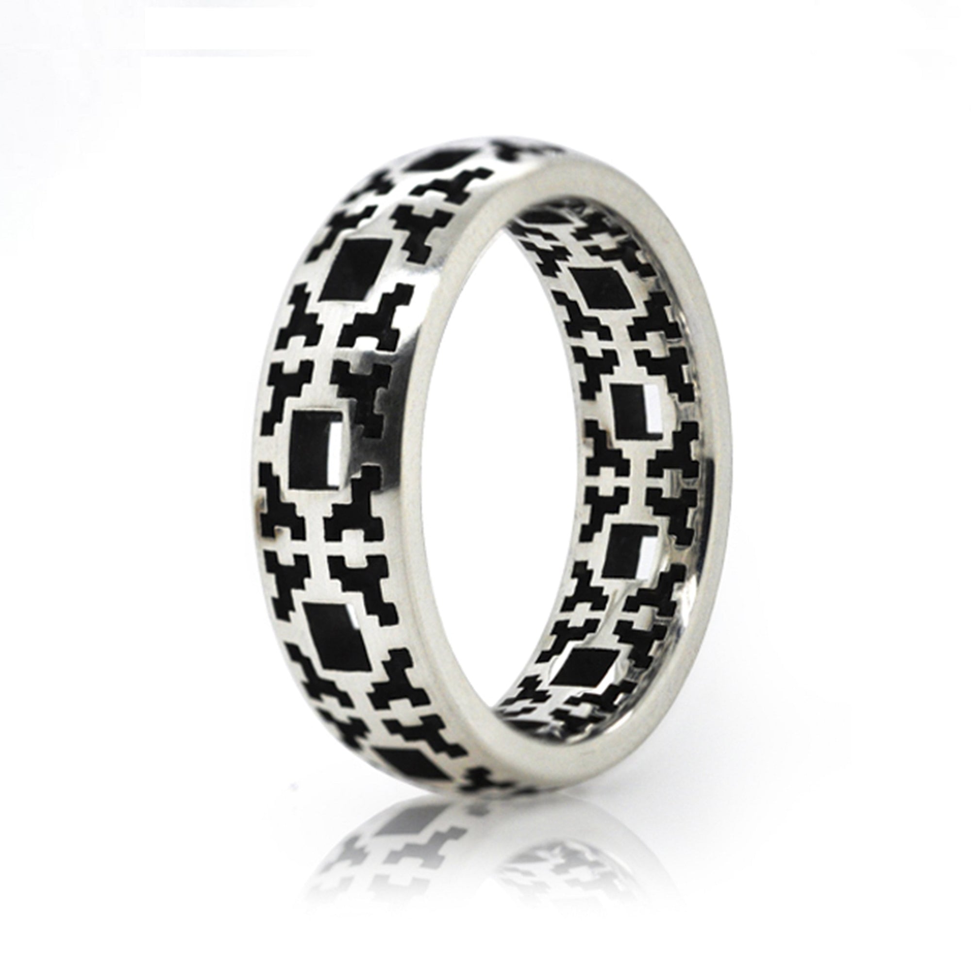 Sterling Silver ring featuring patterns of small squares. 