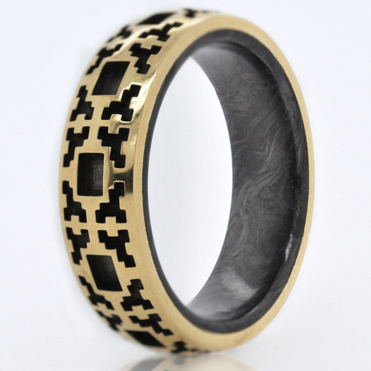 Wedding band featuring a Square Pattern exterior cast in 14K Gold with a Forged Carbon Fiber interior. 