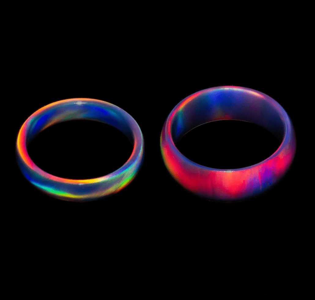 Two multi-colored opal rings in 4mm and 6mm widths. 