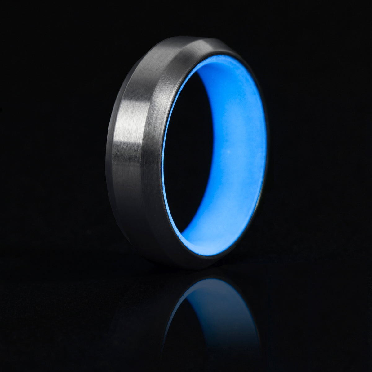 Blue glow ring with titanium exterior and beveled edges.