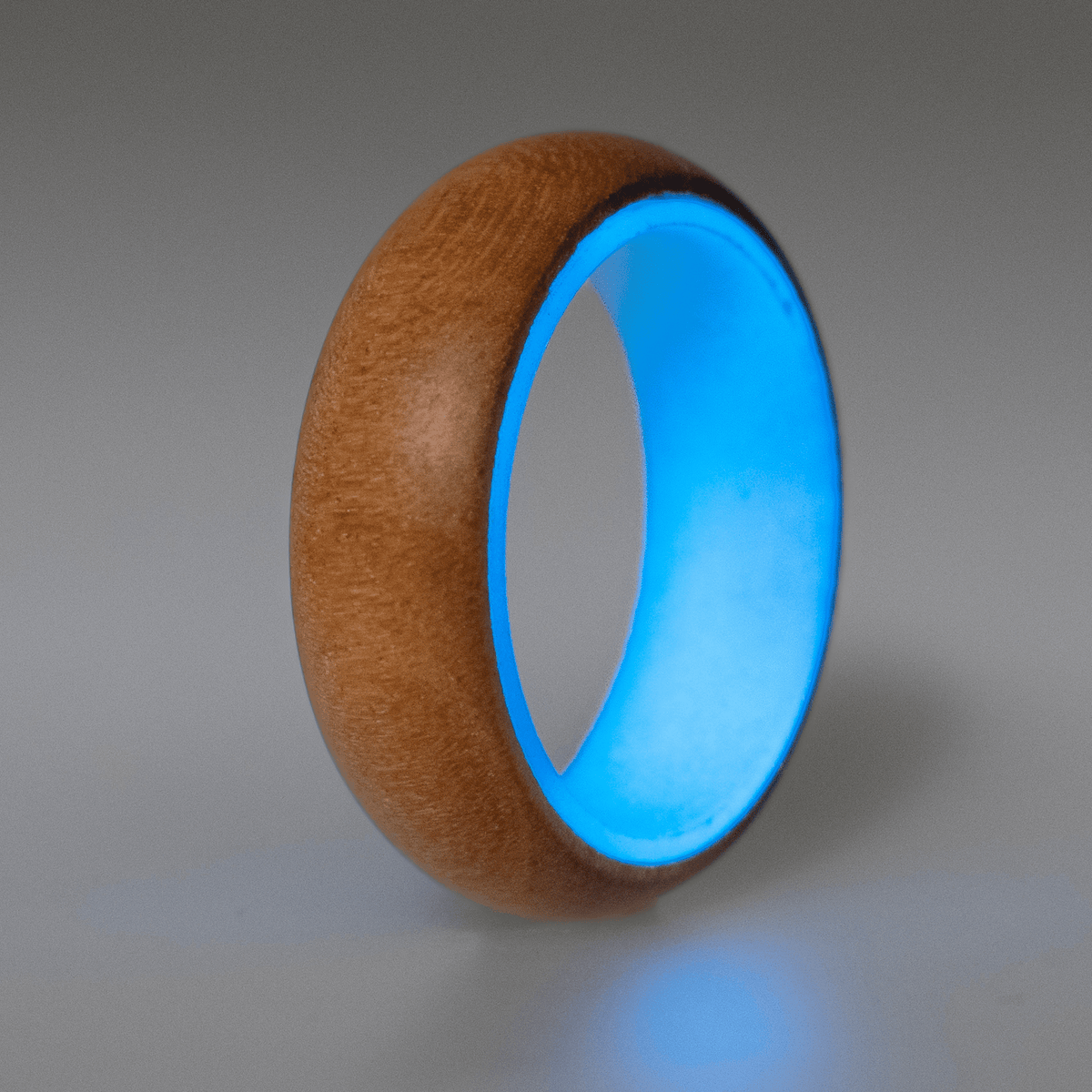 Blue glow ring with a cherry wood exterior. 