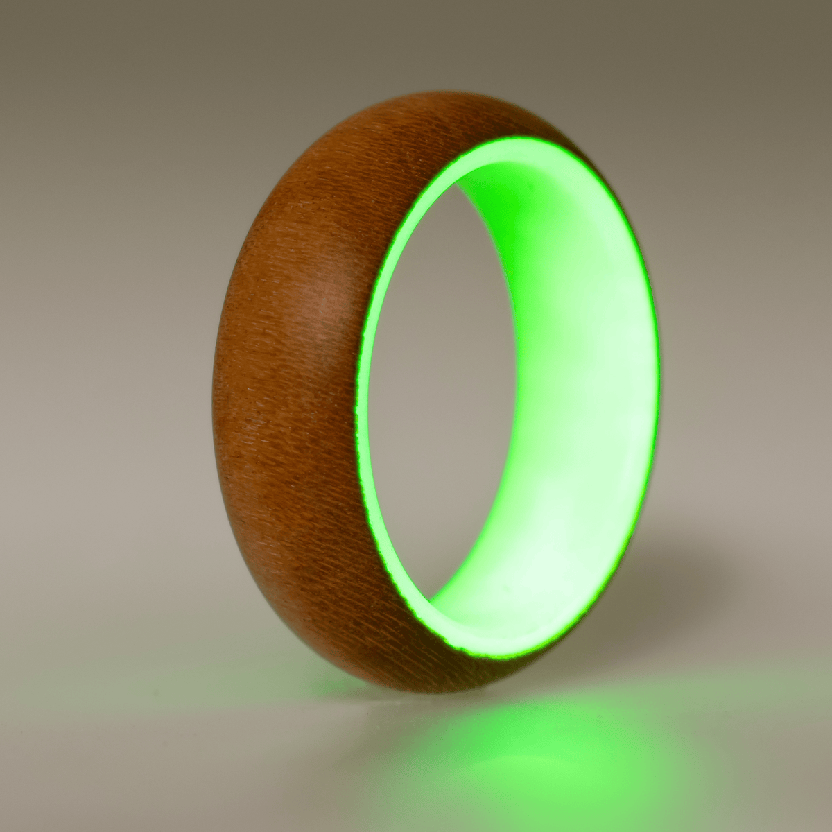 Green glow ring with a cherry wood exterior. 