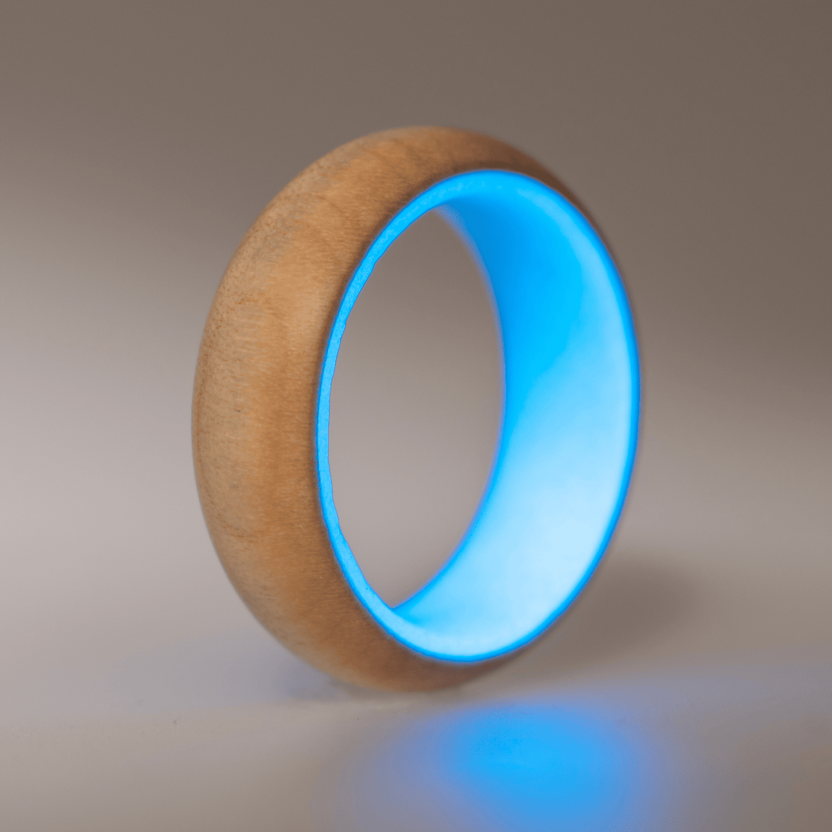 Blue glow ring with a maple wood exterior. 