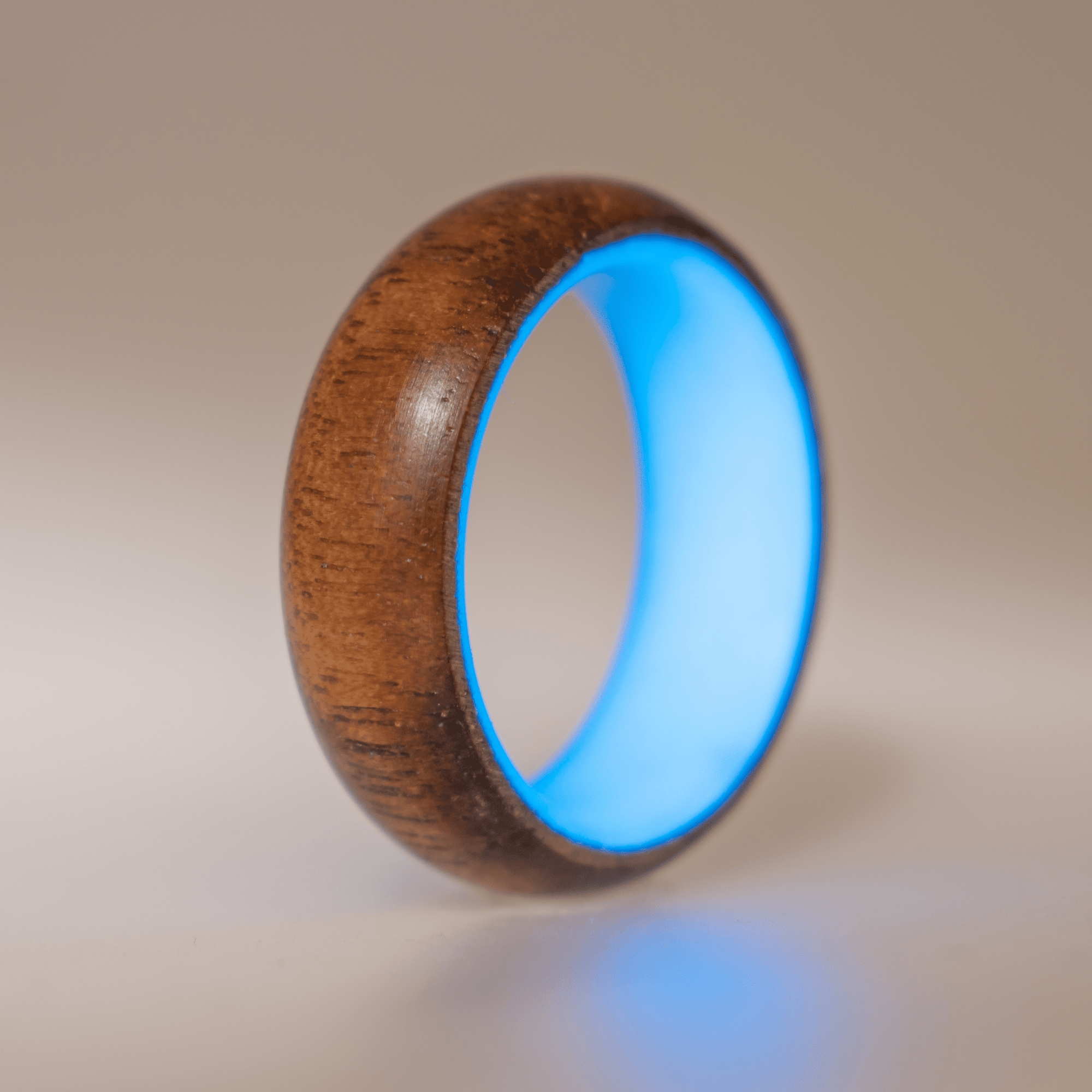 Blue glow ring with walnut wood exterior. 