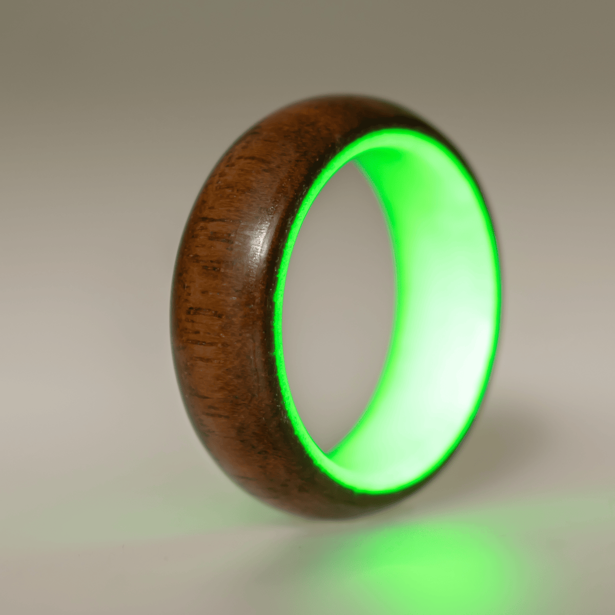 Green glow ring with walnut wood exterior. 