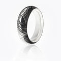 Damascus Steel radius ring with woodgrain pattern on exterior, and smooth silver interior. 