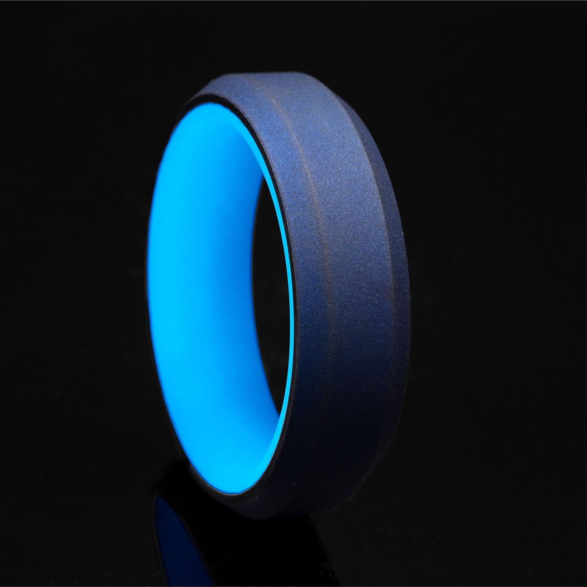 Blue glow ring with blue anodized titanium exterior and beveled edges.