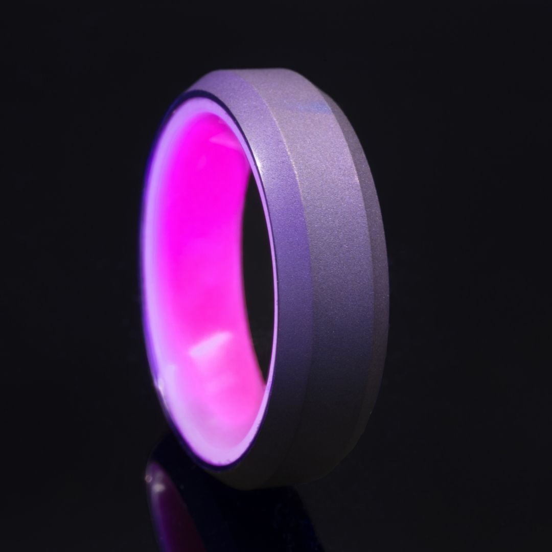 Purple glow ring with purple anodized titanium exterior and beveled edges.